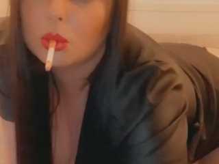 Smoking in a leather dress with red lipstick – full video on my onlyfans- link in bio & in comments