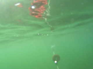 red stocking in the sea at the public beach