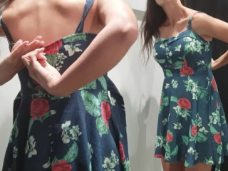 Girl changes clothes in a fitting room