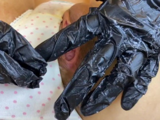 A Japanese  girl wearing gloves. Pussy dilator, fuck machine