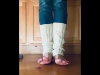 Hot mom in jeans with legwarmers takes slippers off