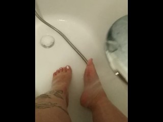 Fat legs feet washing after long day at work