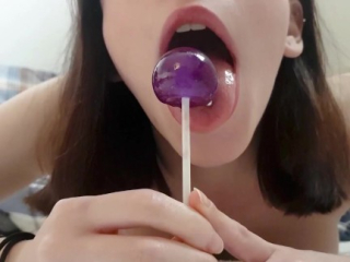 Candy girl fucks and tastes both her holes with a Lollipop